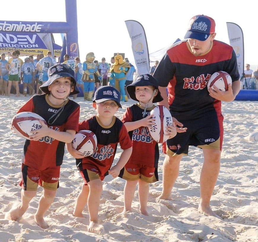 Kids Playing Rugby at the Beach